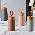 Portable wood grain lid thermos